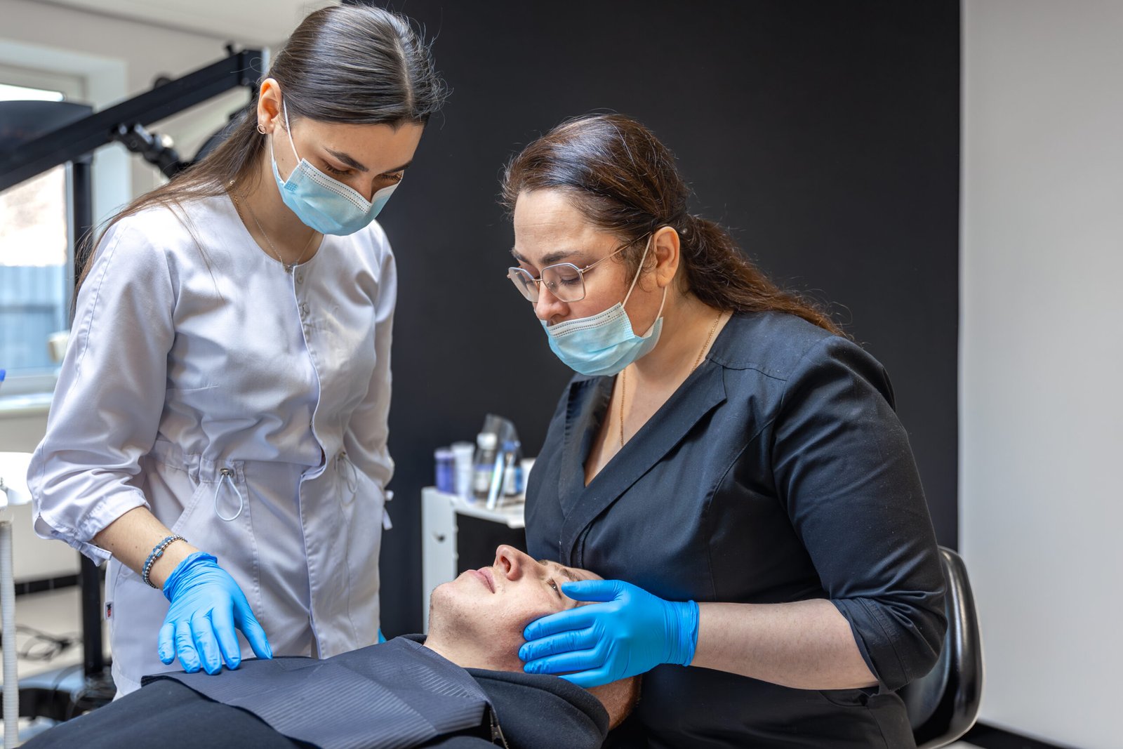 team of female dentists treating patient's teeth. visit to the dentist. dentistry.